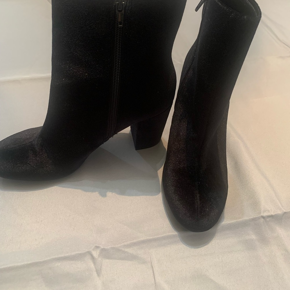 Christian Siriano black books with side zipper.